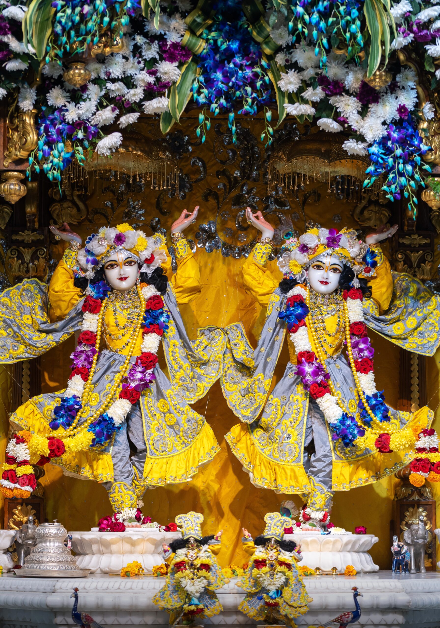 Colorful deities adorned with flowers, Lord Chaitanya Mahaprabhu & Nityananda Prabhu In Yellow Dress